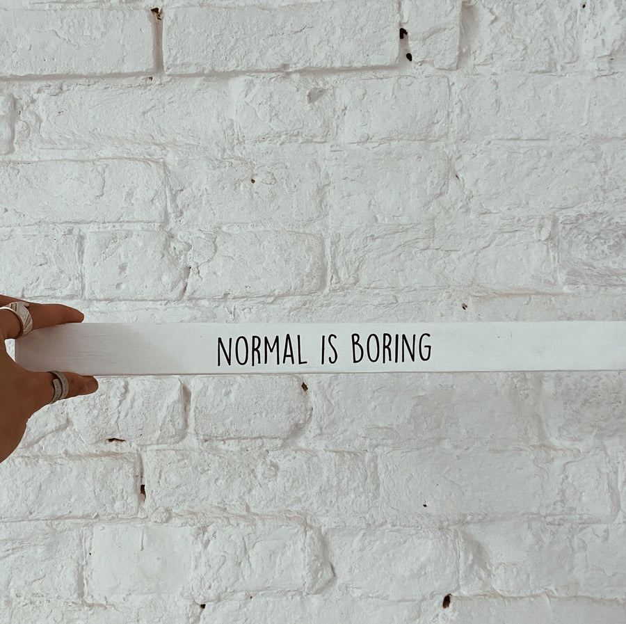 “Normal is boring” poetry stick